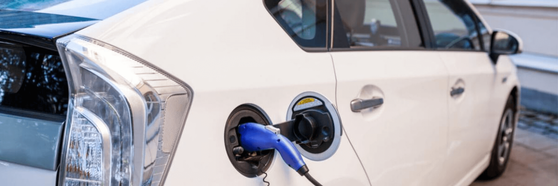 Close up of the power supply plugged into an electric car being charged