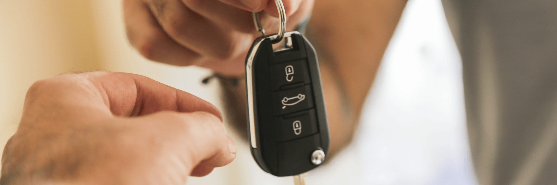 Man handing over keys to mechanic