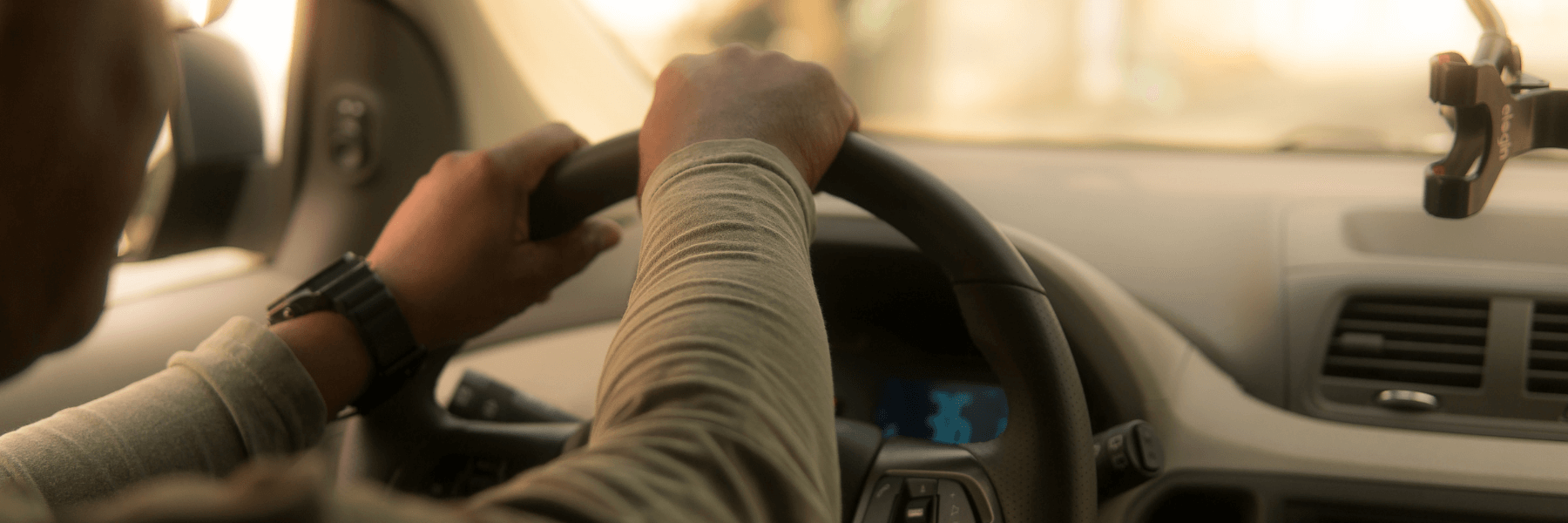 A man driving his car